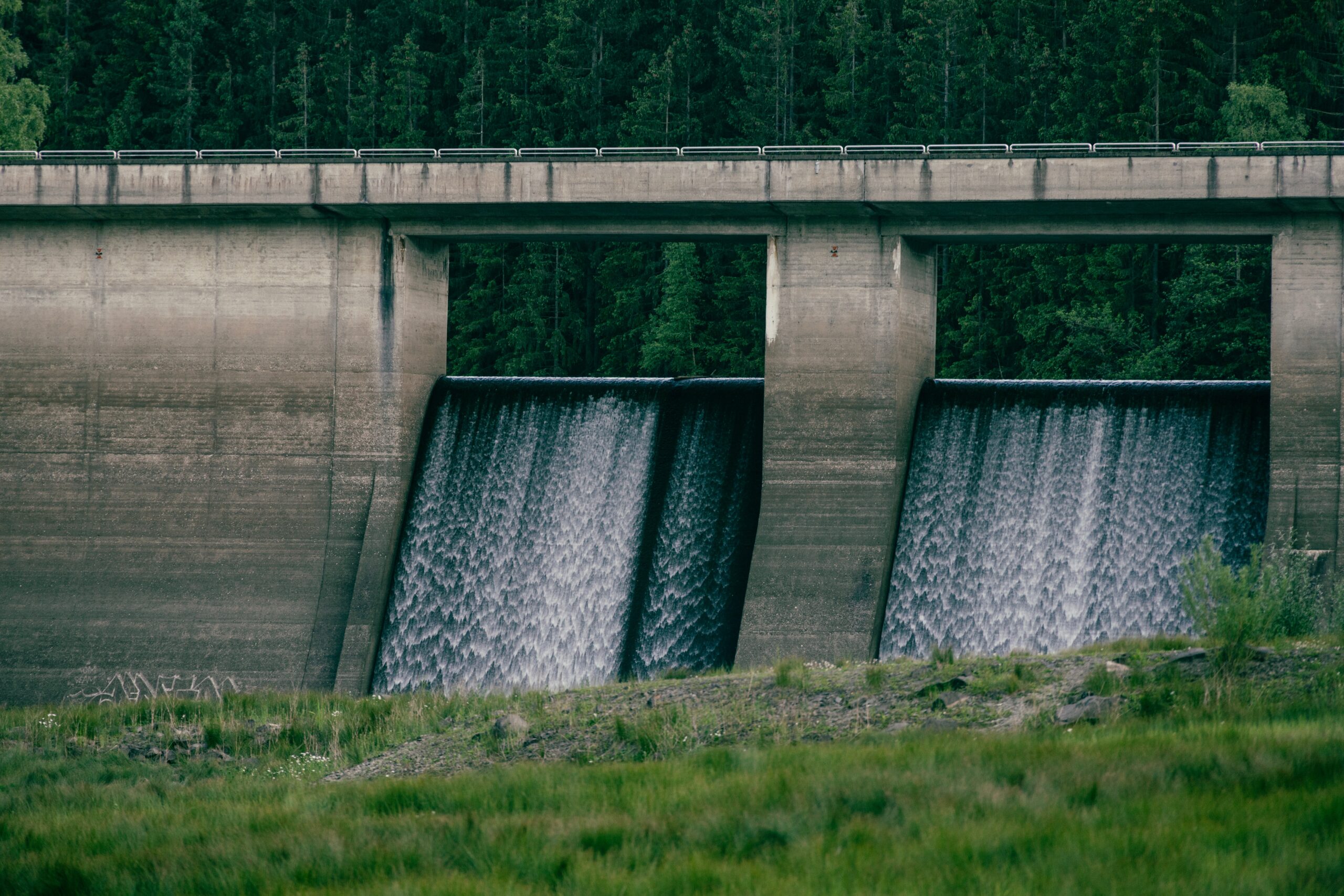 water flowing from a dam in nature