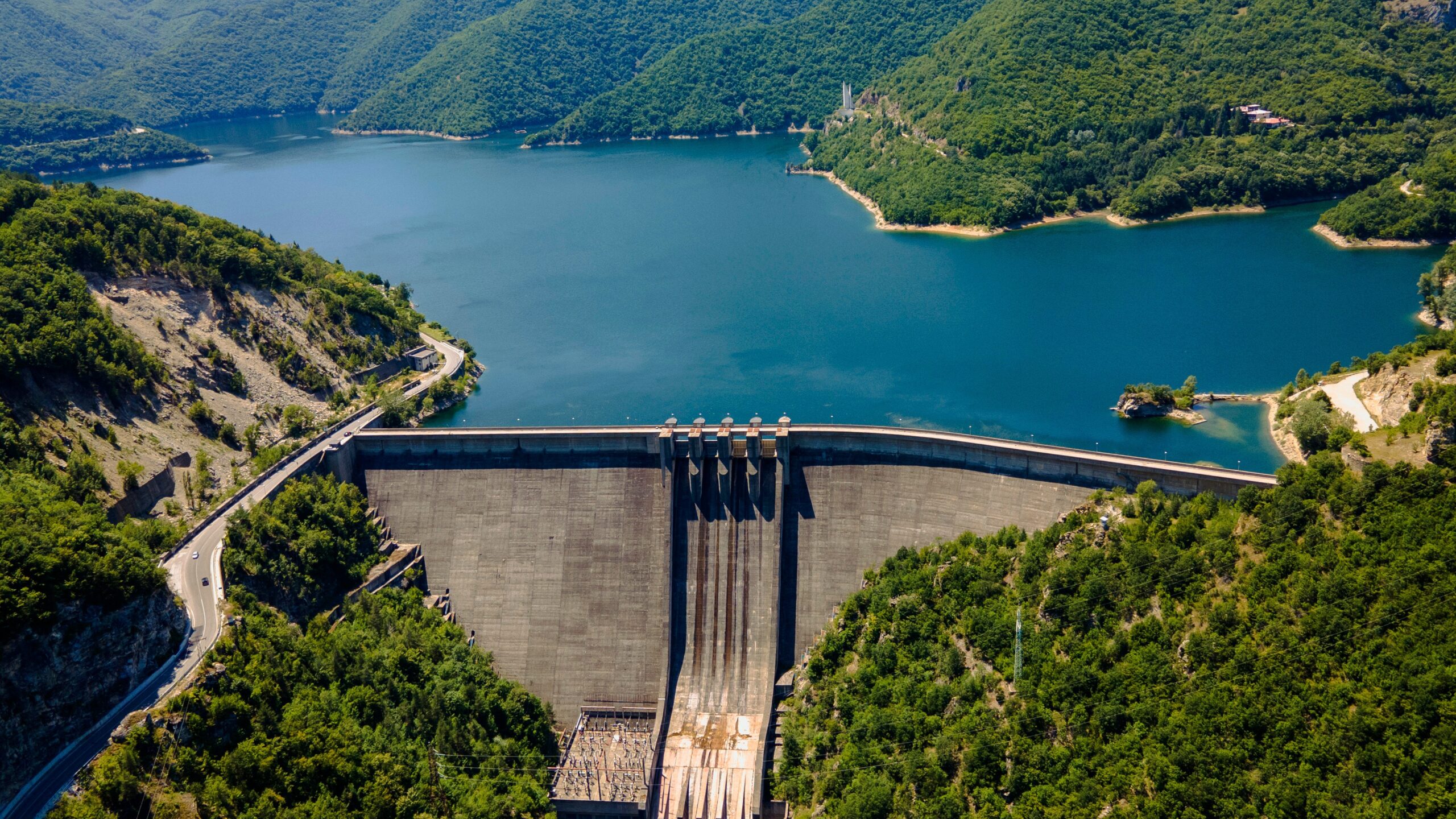 huge hydro dam with beautiful green landscape around it