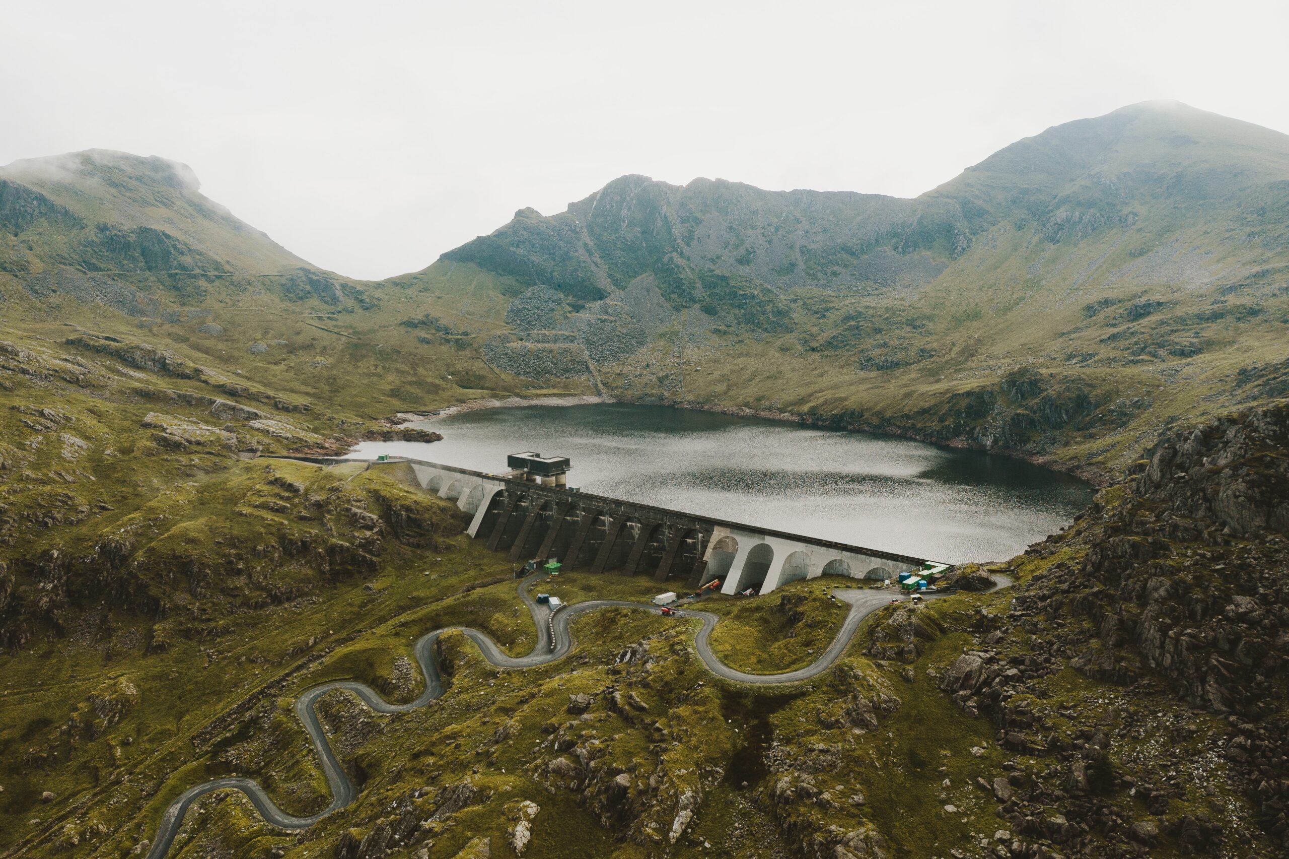 wide shot of a dam and a clean lake