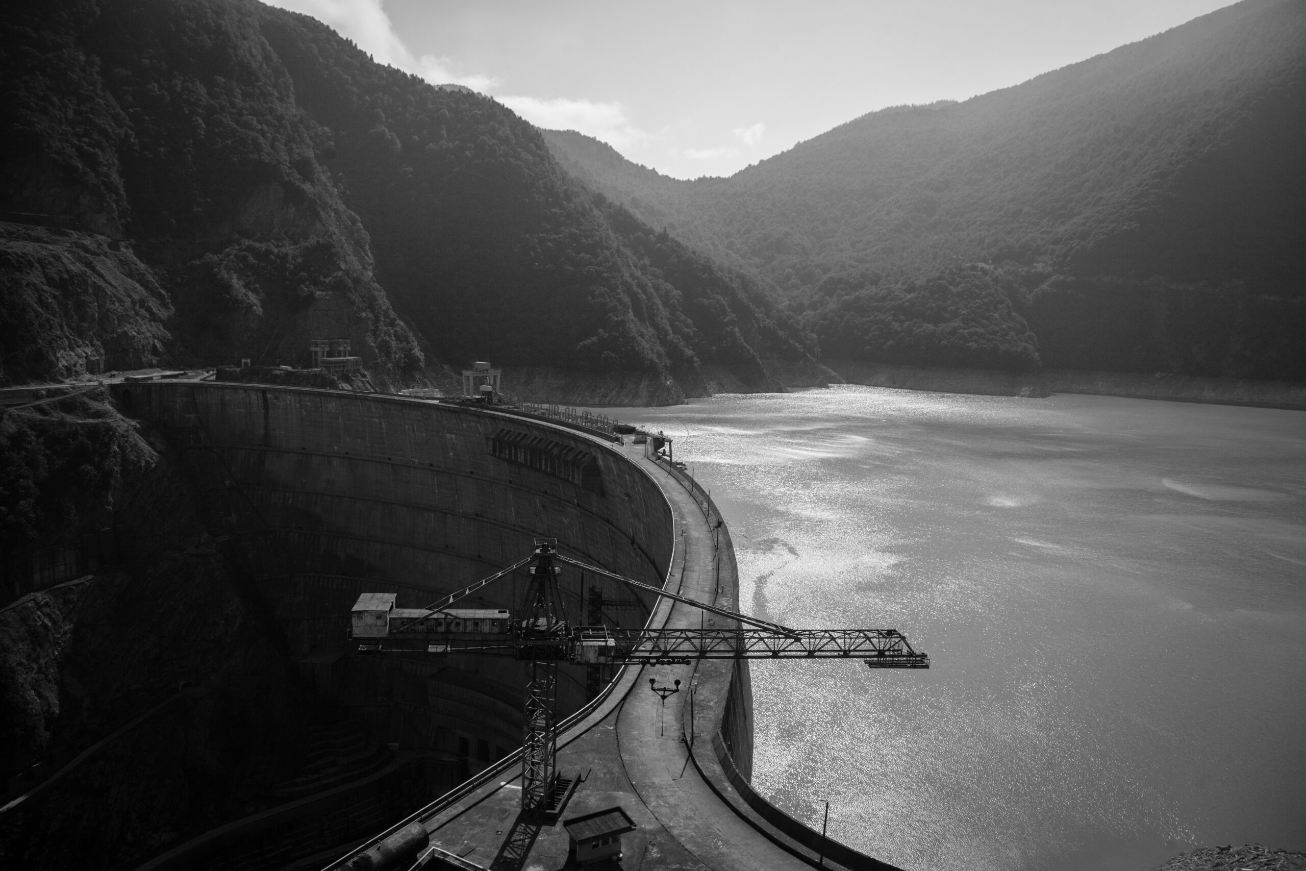 black and white photo of a dam being built